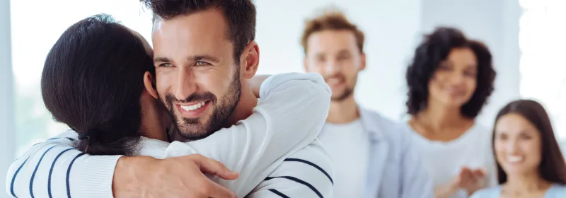 A organ donor hugs someone they helped save with a living donation.