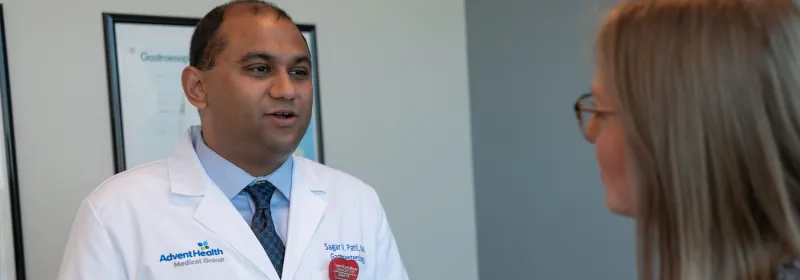 A Doctor Speaks to an Patient in an Exam Room