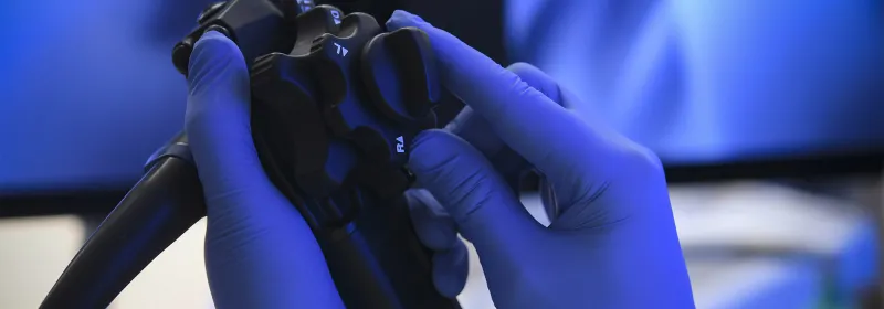 A surgeon's hands holding Endoscopy Equipment