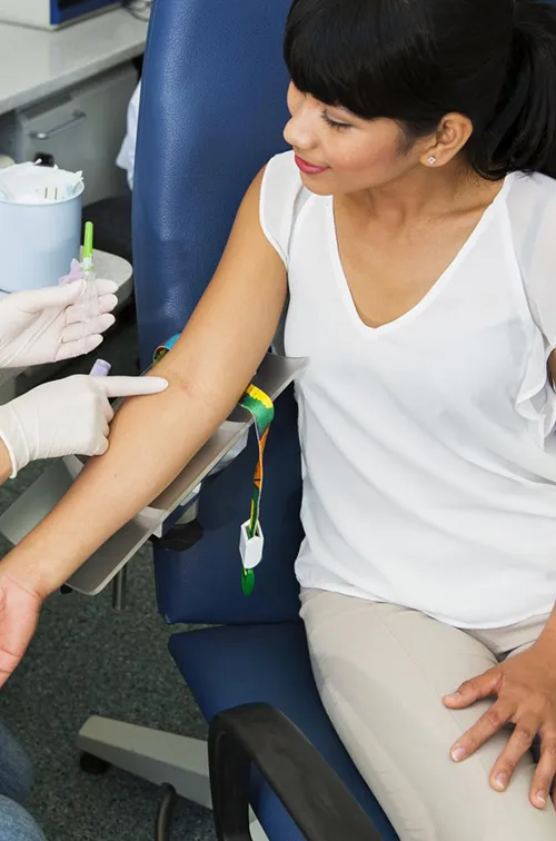Woman prepares to have her blood drawn