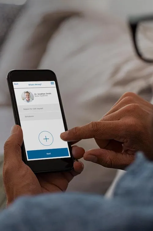 Man using app on a smartphone for a video visit
