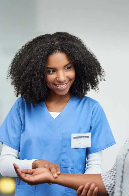 Nurse checking a patient's pulse