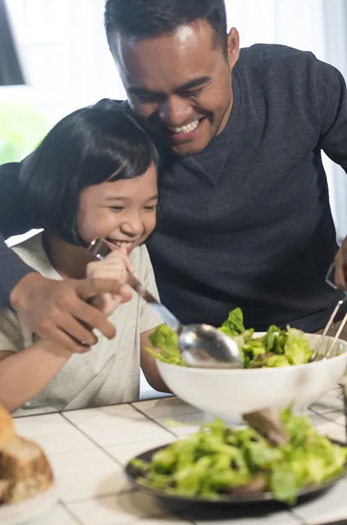 A family makes a meal together