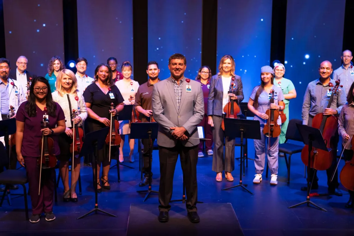 Director saw orchestra as the perfect way to bring team members together during a dark time.