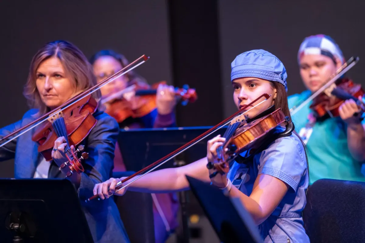 Director saw orchestra as the perfect way to bring team members together during a dark time.