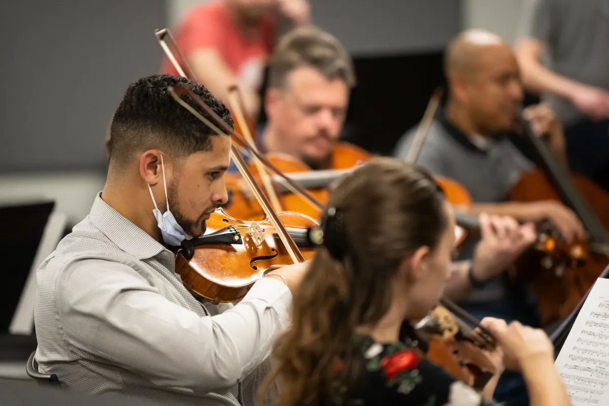 The AdventHealth employee orchestra rehearses.