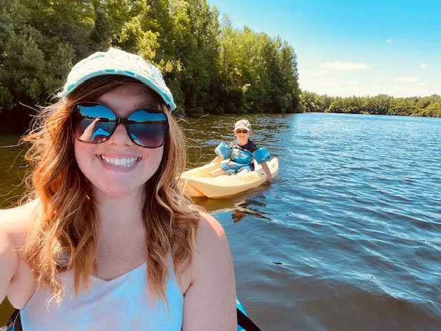 Thieman and her son kayaking on the water.